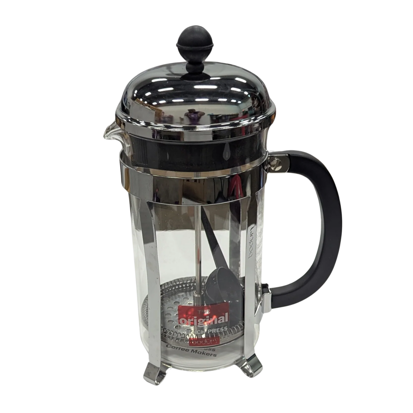 French press coffee maker with clear glass body and black handle on a white background
