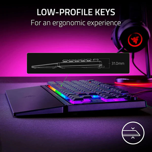 Gaming keyboard with low-profile keys on a purple background, featuring text about ergonomic experience.