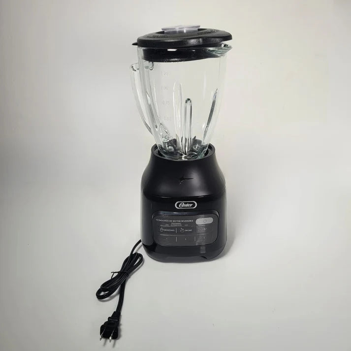 Black blender with clear container on a light gray background