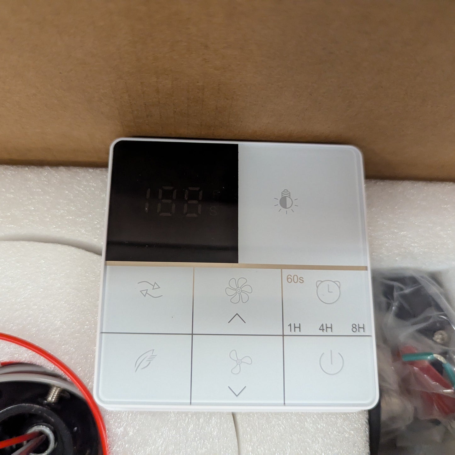 Control panel for a heating system with various buttons on a white surface.