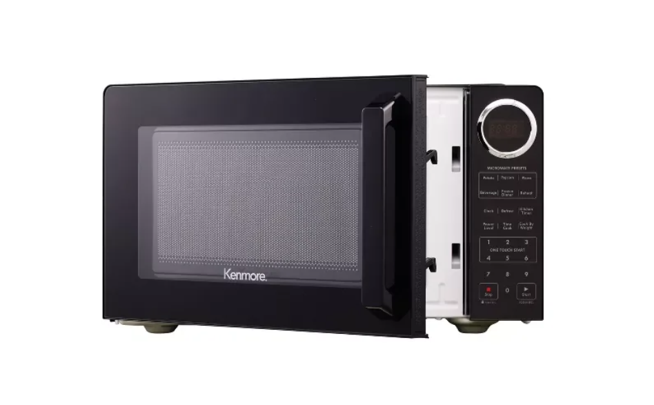 Black microwave oven with digital display on a white background