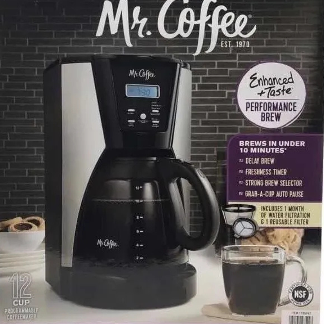 Mr. Coffee coffee maker with packaging on a gray brick wall background