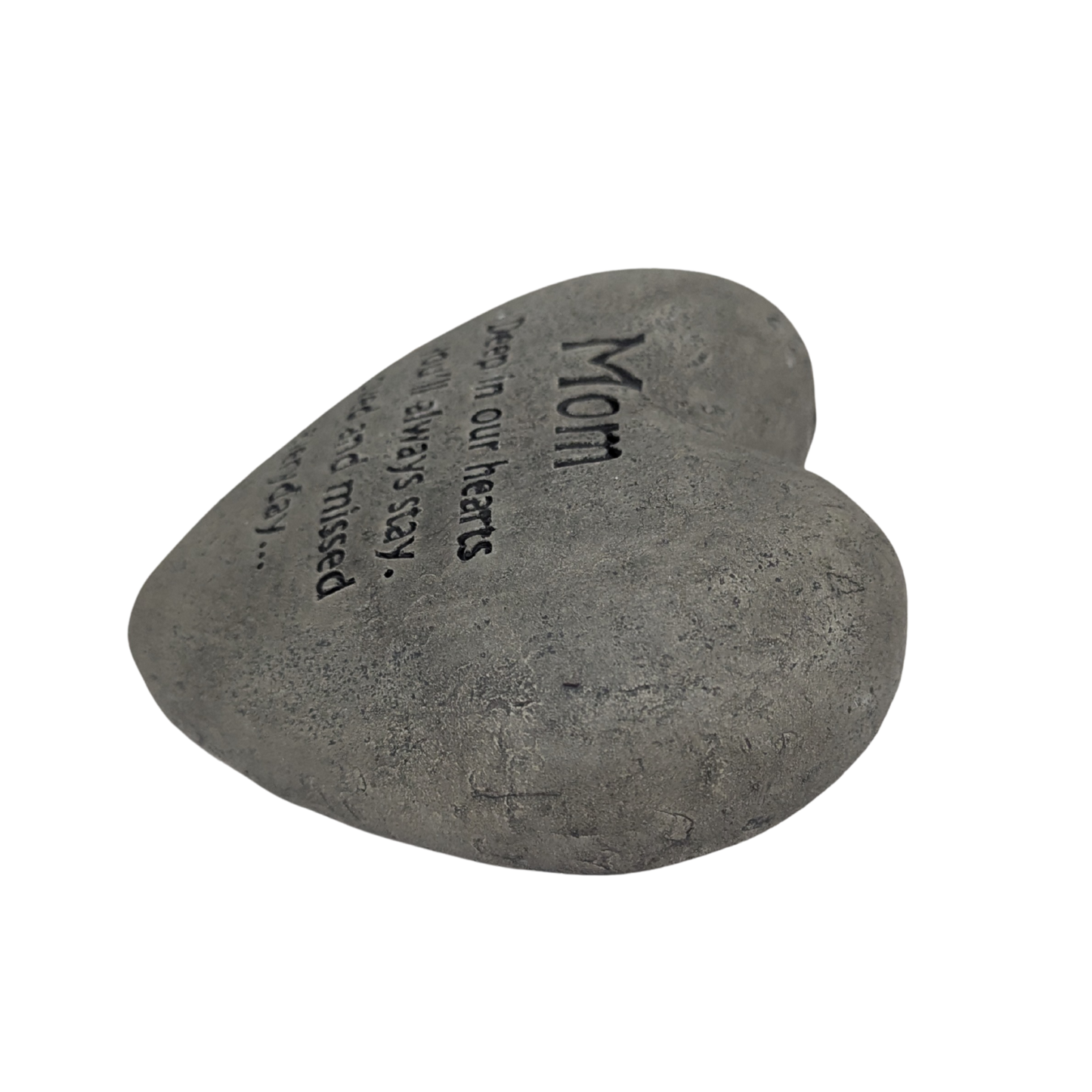 Heart-shaped stone with engraved text on a white background