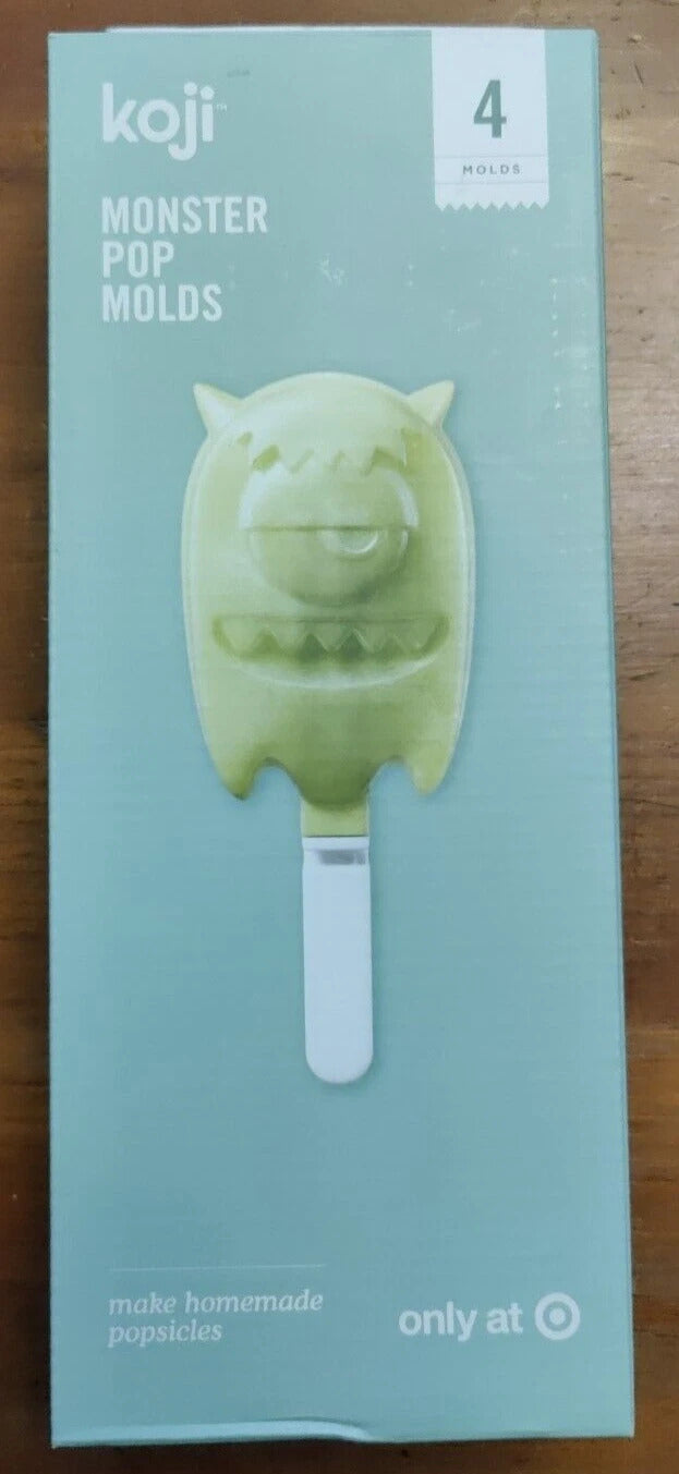 Koji Monster Pop Molds packaging on a wooden surface