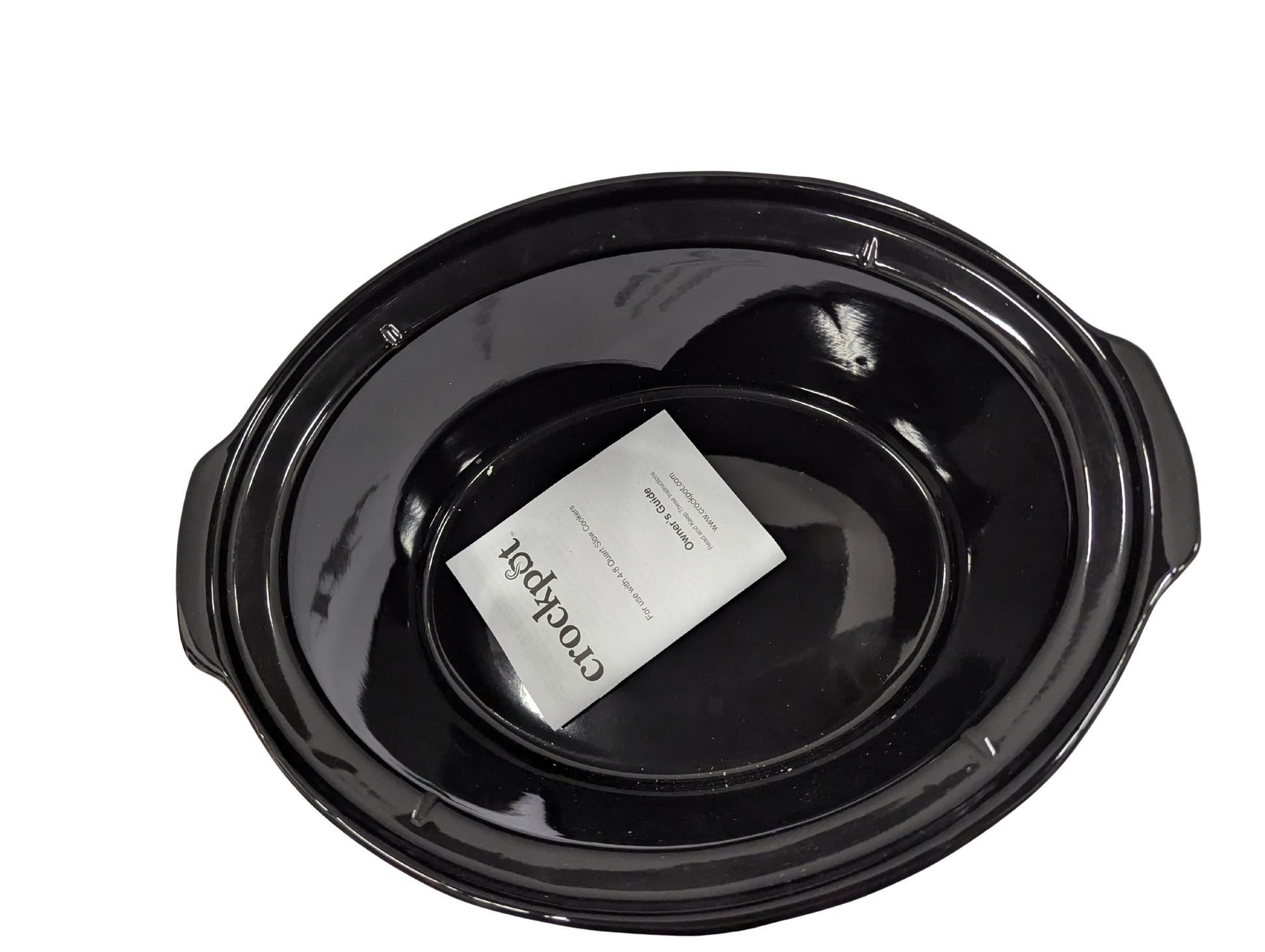 Black crock pot with a white label on a white background