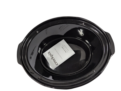 Black crock pot with a white label on a white background