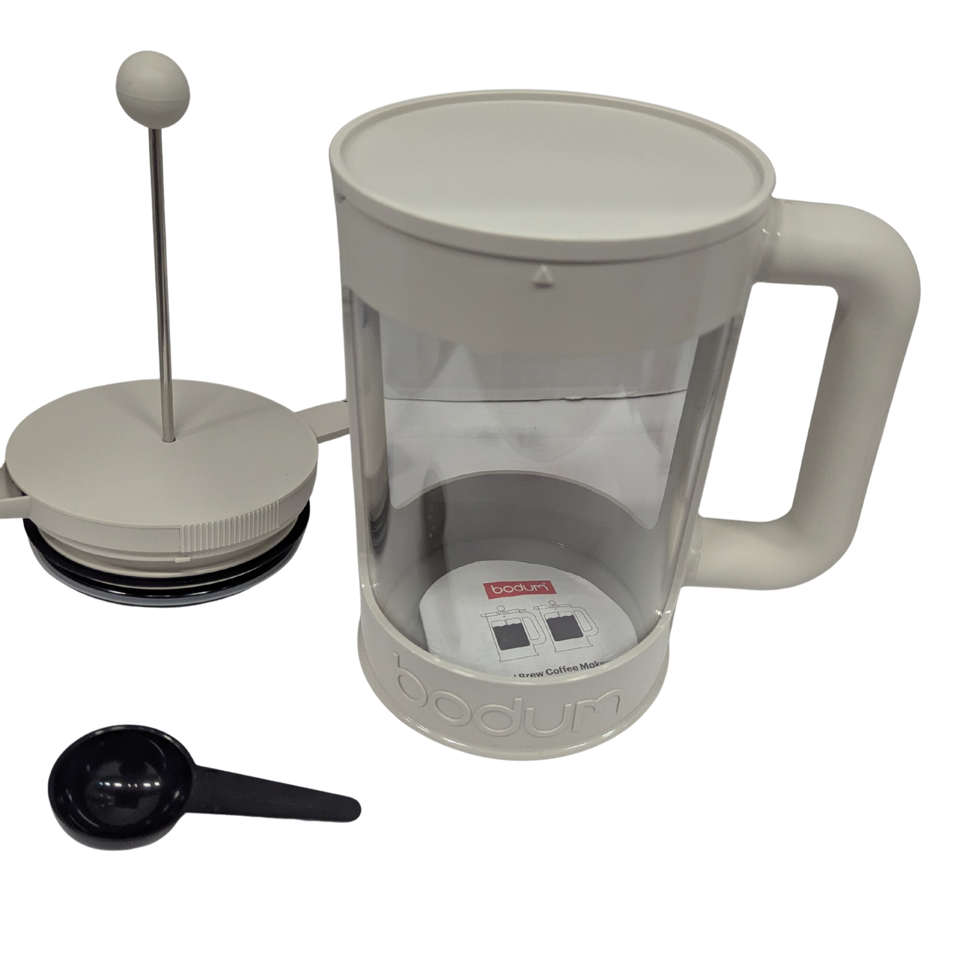 White French press coffee maker with a black scoop on a white background