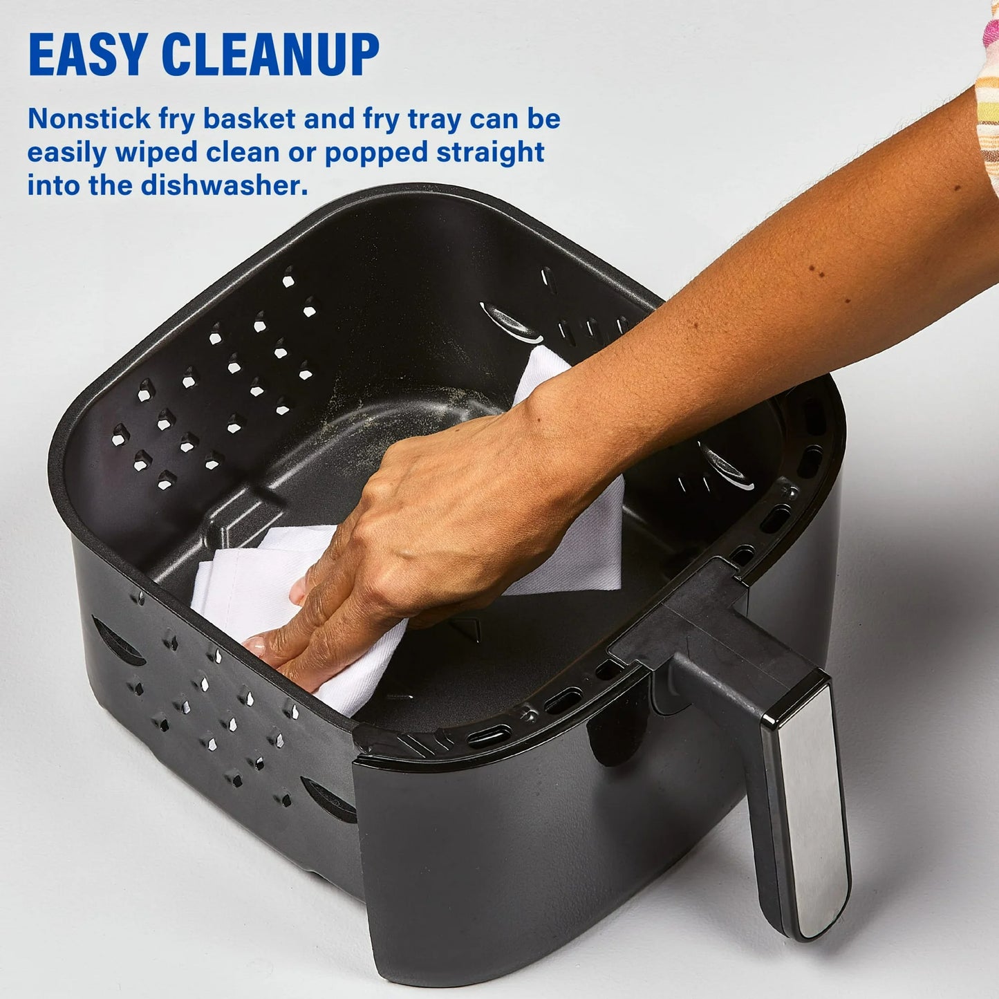 Black fry basket with a hand wiping it clean on a gray background, text about easy cleanup.