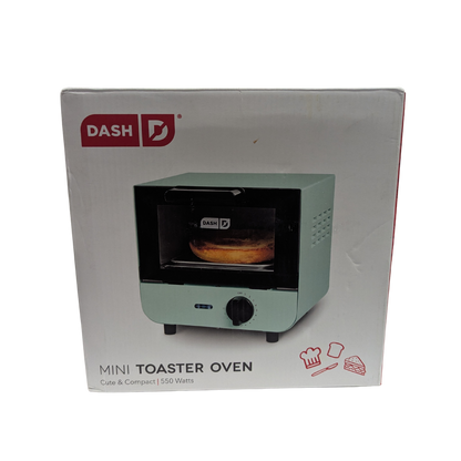 Boxed Dash mini toaster oven on a white background