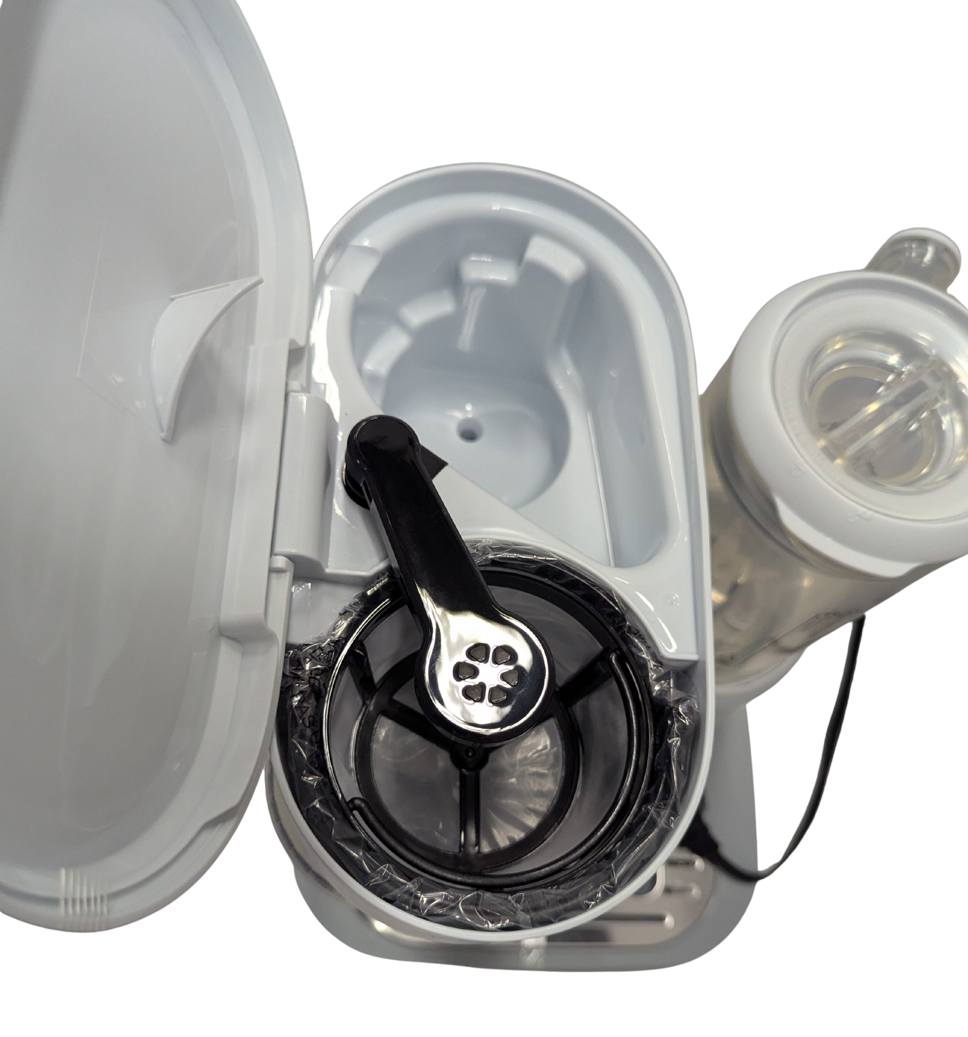 Close-up of a medical device with a clear cover on a white background