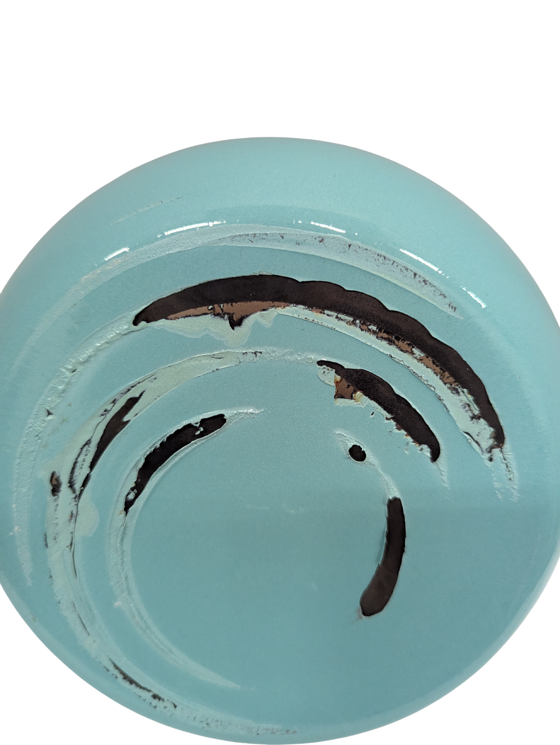 Light blue ceramic plate with black abstract design on a white background