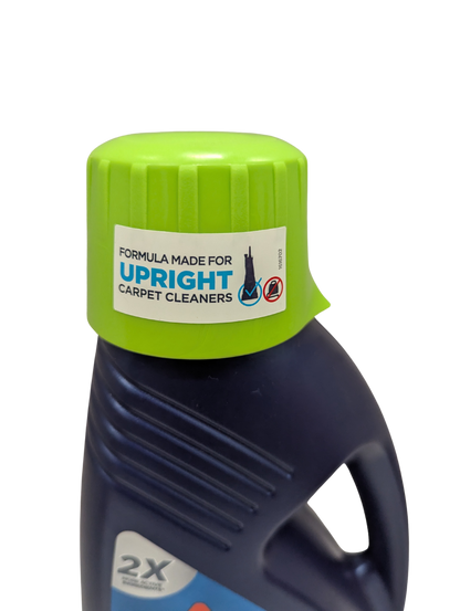 Bottle of detergent with a green cap and label on a white background