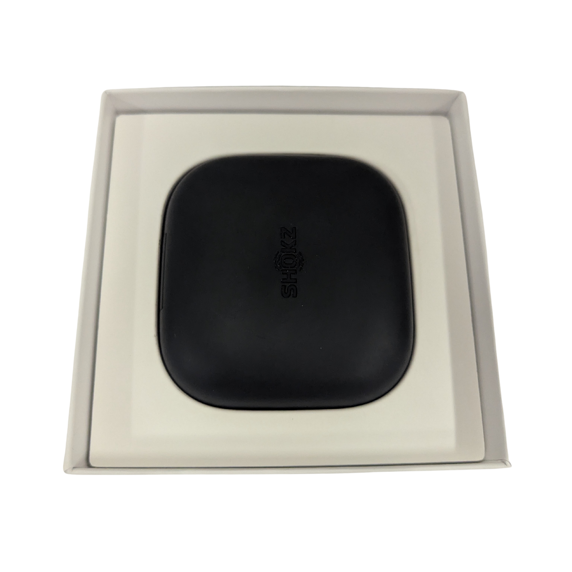 Black square object with 'Bose' branding in a beige box on a white background