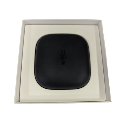 Black square object with 'Bose' branding in a beige box on a white background