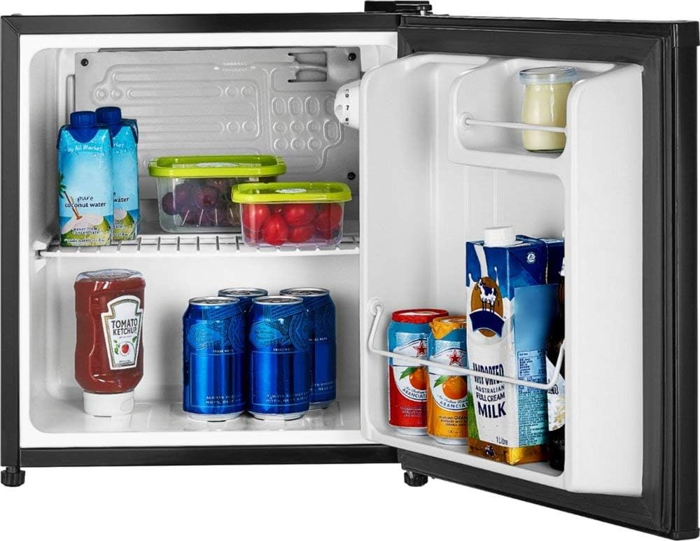 Open mini refrigerator with various food items inside
