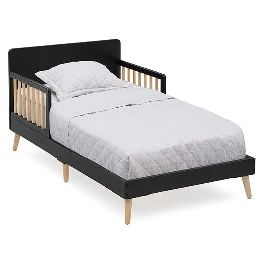 Black and wood children's bed with white bedding on a white background