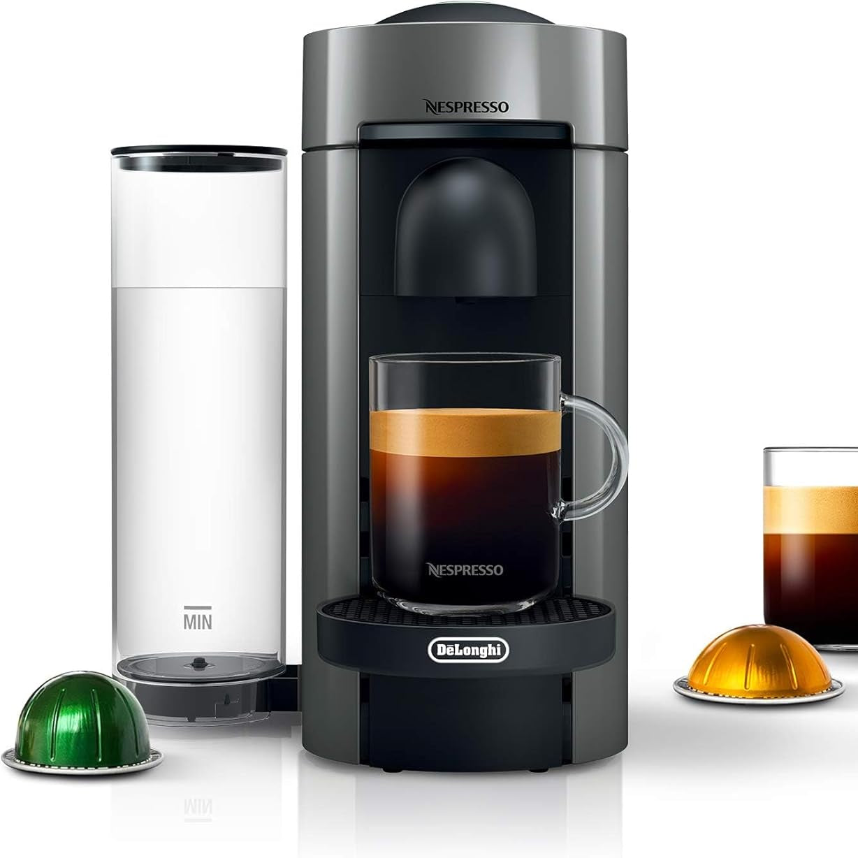Nespresso coffee machine with a glass of coffee and capsules on a white background