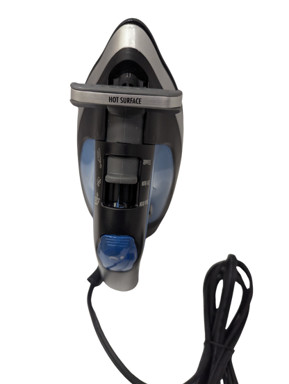 Black and silver iron with a blue light on a white background