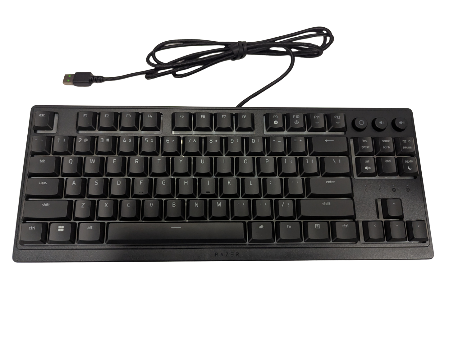 Black keyboard with USB cable on a white background
