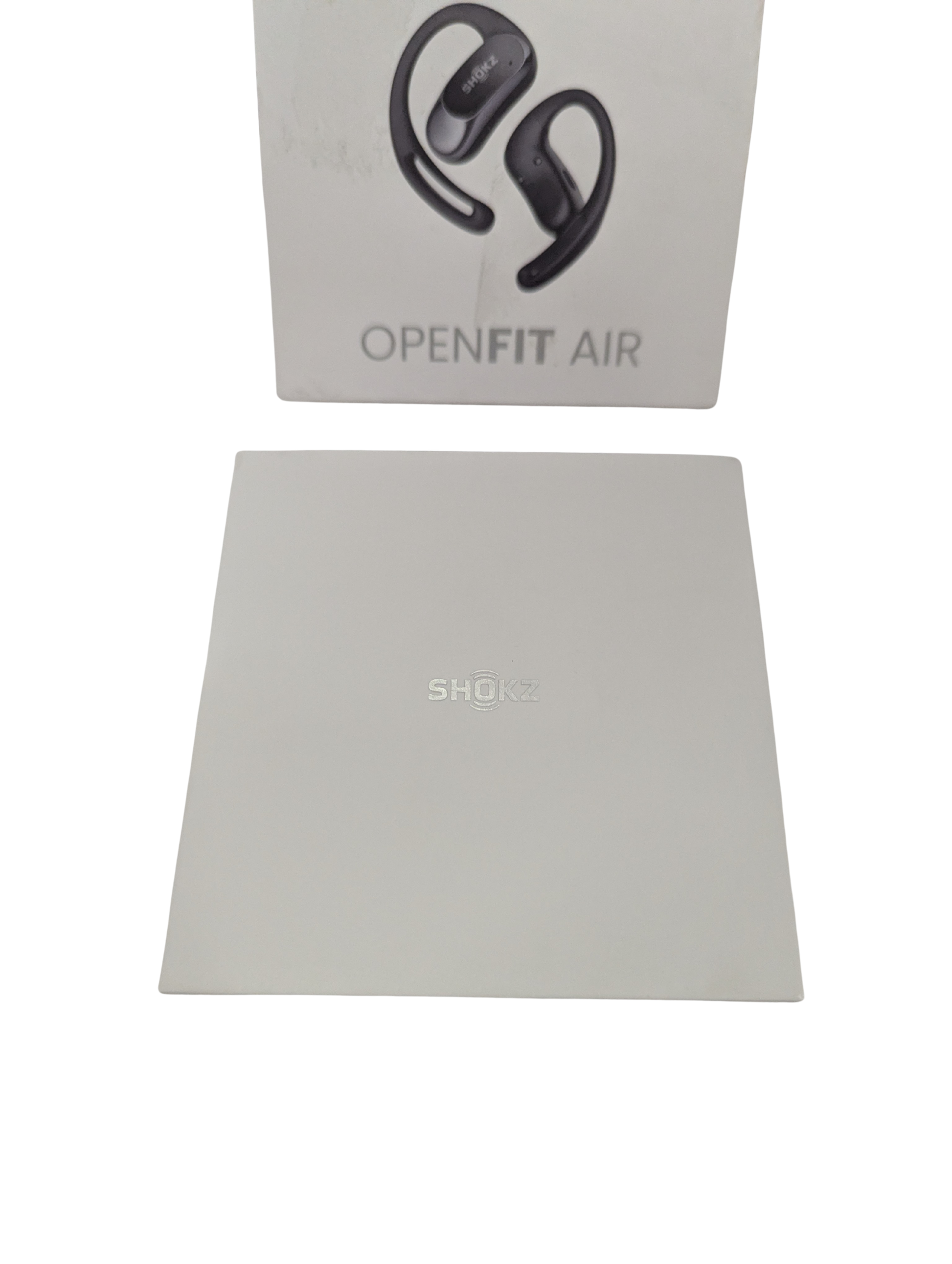 Shokz OpenFit Air earbuds with packaging on a white background