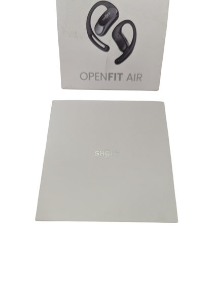 Shokz OpenFit Air earbuds with packaging on a white background
