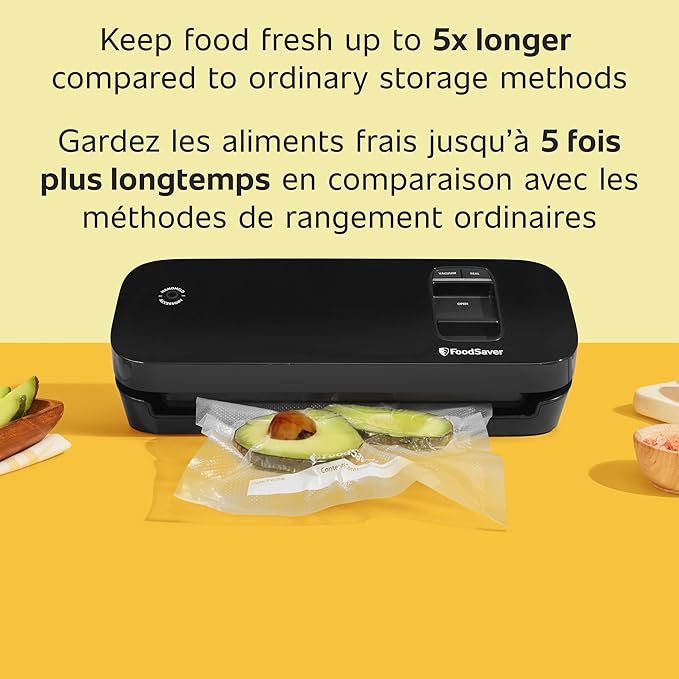Black vacuum sealer with food on a yellow background, promoting extended food freshness.