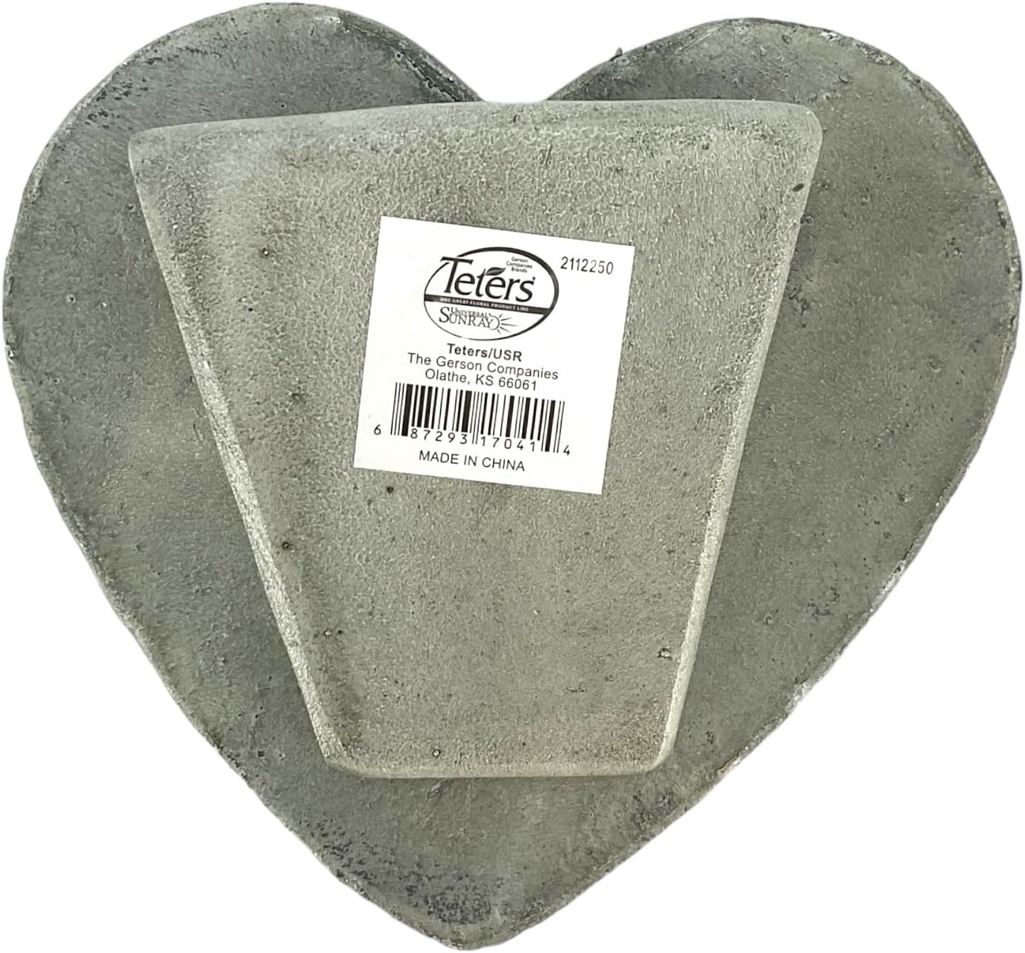 Heart-shaped concrete block with a label on a white background