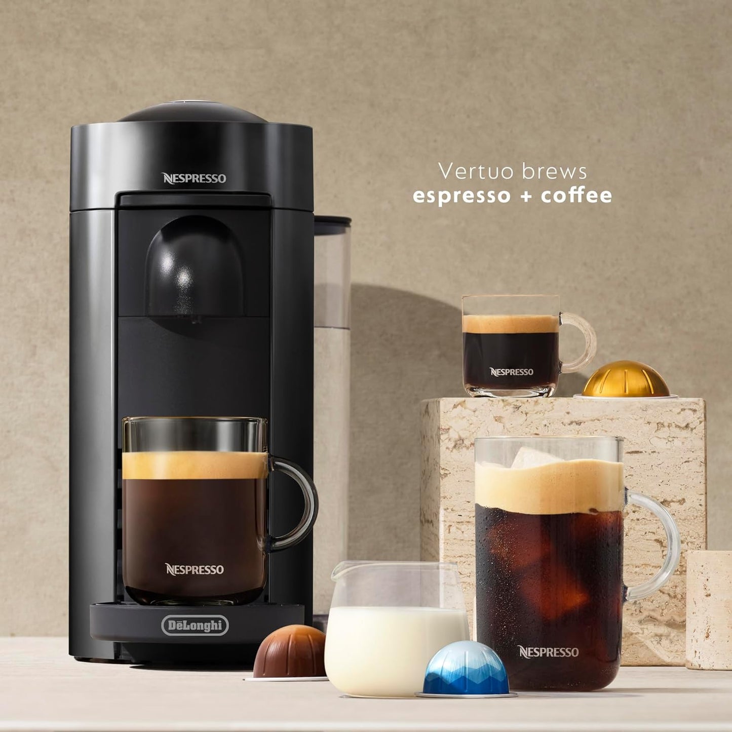 Nespresso coffee machine with various coffee beverages on a neutral background