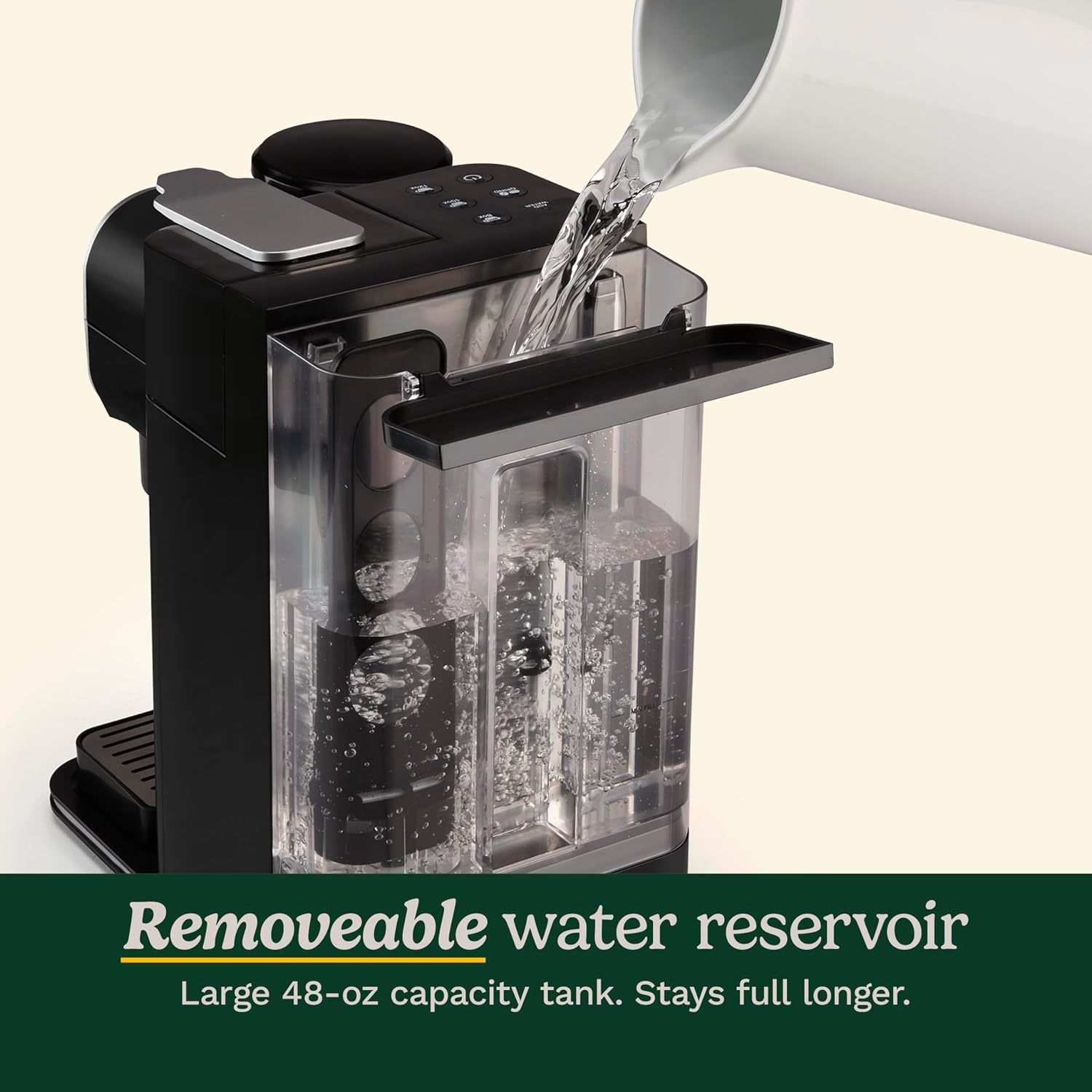 Black water dispenser with a removeable water reservoir being filled with water from a gray pitcher.
