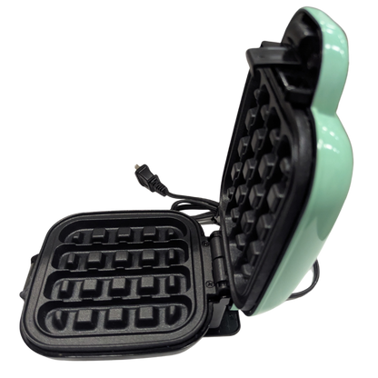 Green waffle maker on a white background