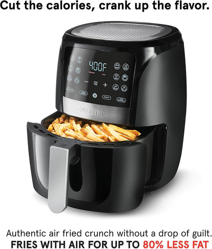 Black air fryer with digital display showing temperature, filled with fries, on a white background.