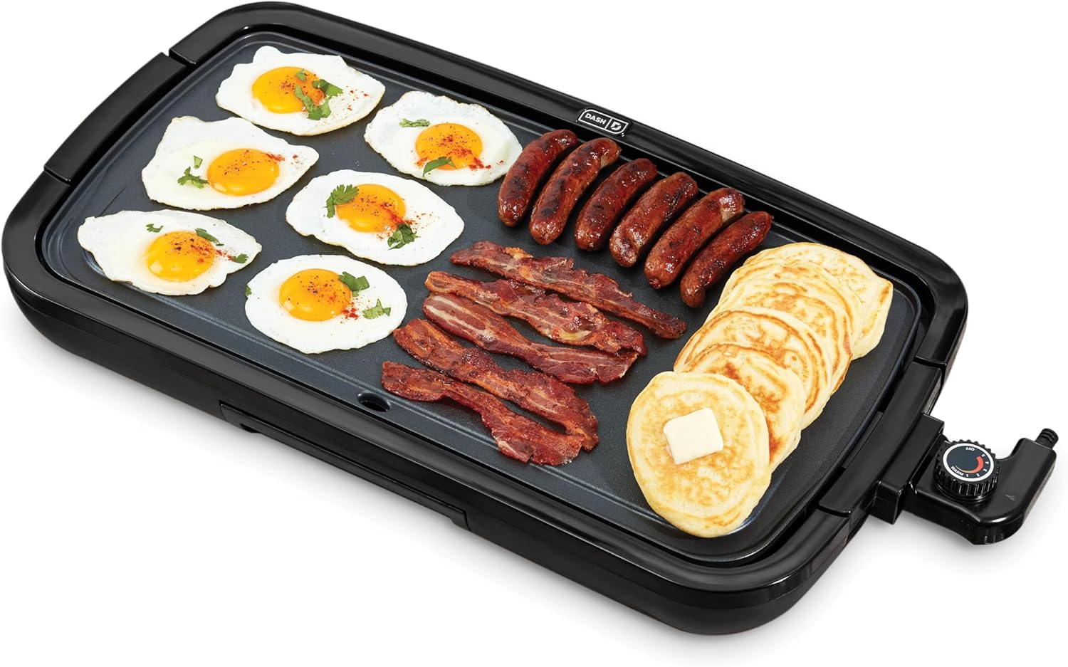 Multifunctional cooking pan with eggs, sausages, and pancakes on a white background