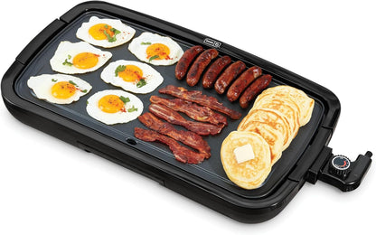 Multifunctional cooking pan with eggs, sausages, and pancakes on a white background