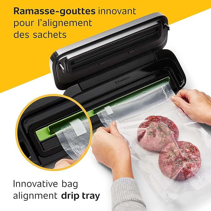 Vacuum sealer with a person using it to seal food, highlighting the 'Innovative bag alignment drip tray' feature.