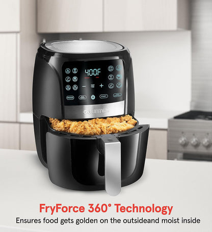 Black air fryer with food inside on a kitchen counter, featuring 'FryForce 360° Technology' text.