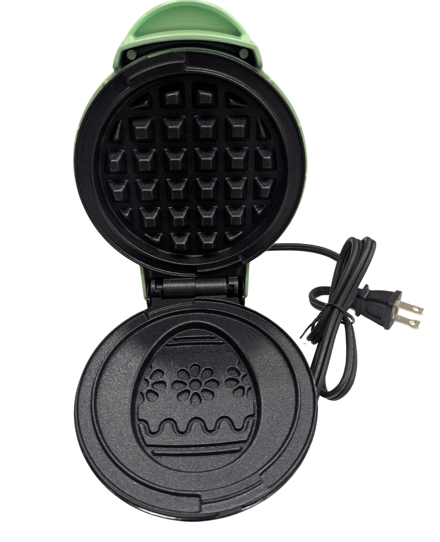 Black waffle maker with a floral design on a white background