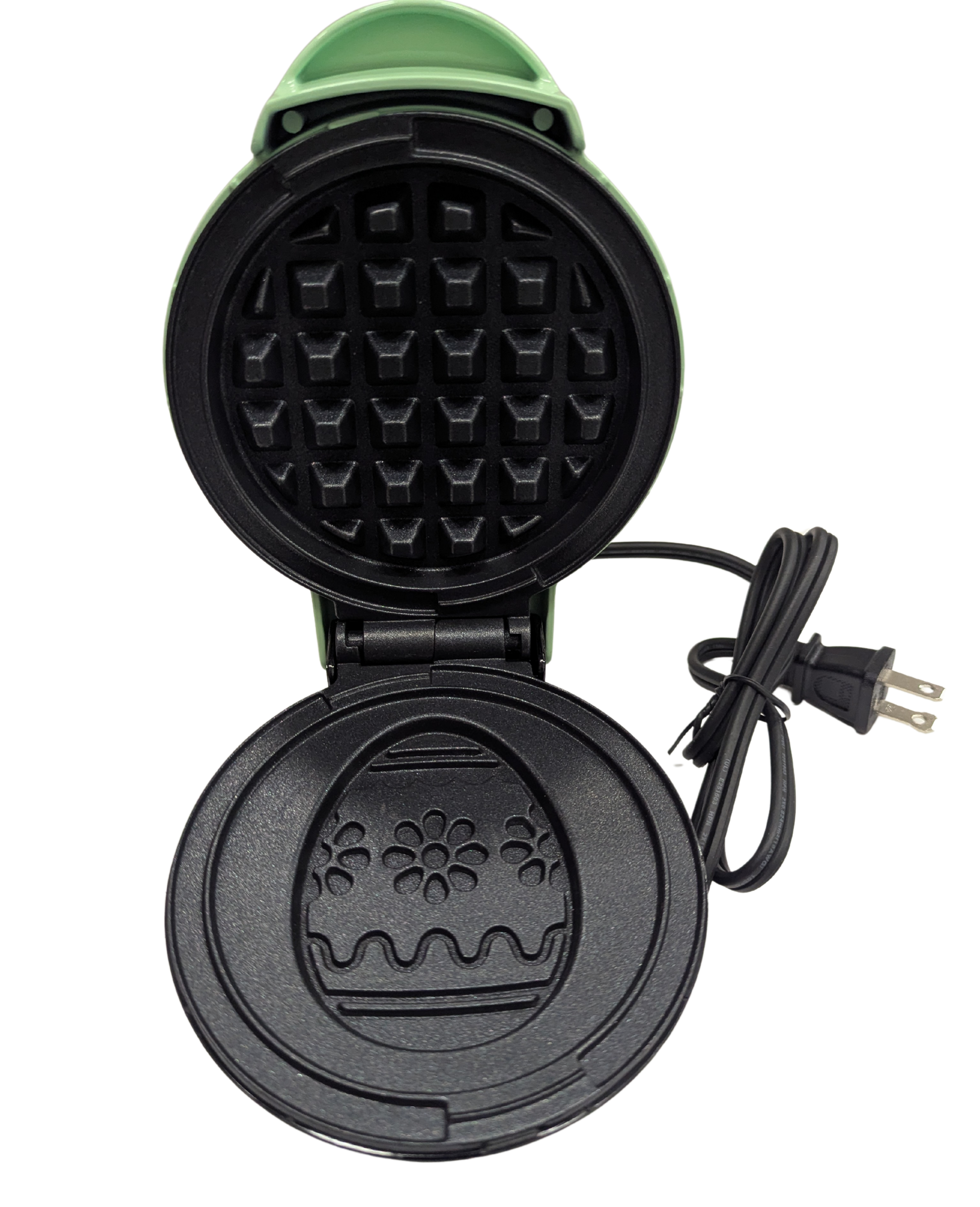 Black waffle maker with a floral design on a white background