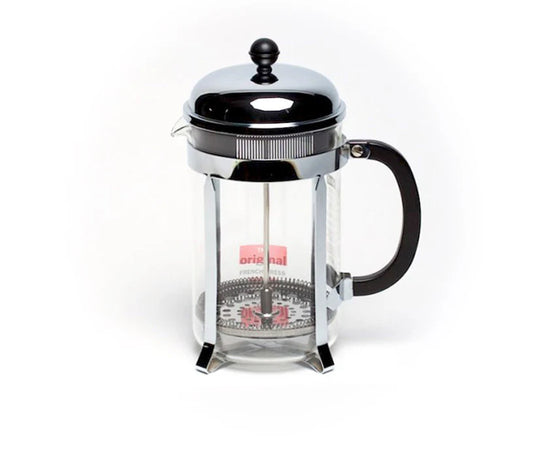 French press coffee maker with a clear glass body and black handle on a white background