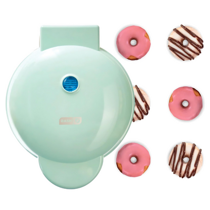 Mint green donut maker with mini donuts on a white background