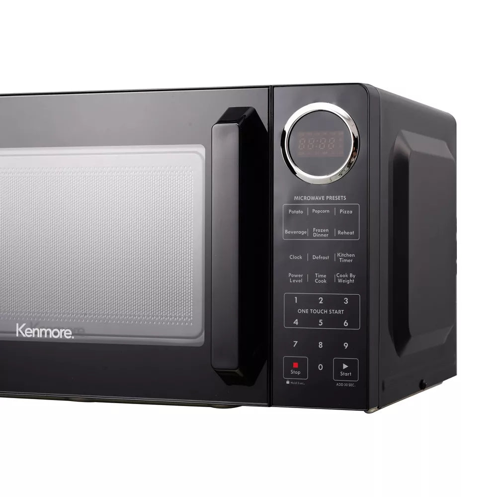 Black Kenmore microwave oven on a white background