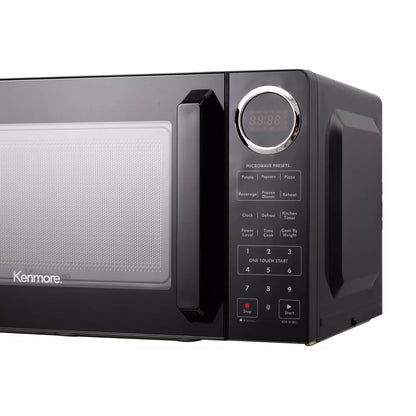 Black Kenmore microwave oven on a white background