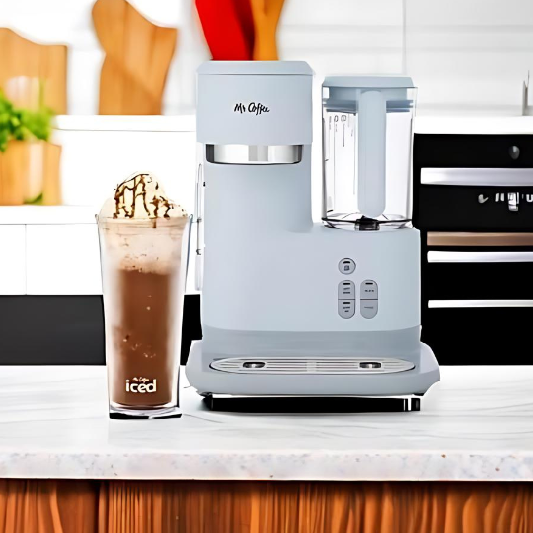 Light blue Mr. Coffee coffee maker with a glass of iced coffee on a kitchen counter.