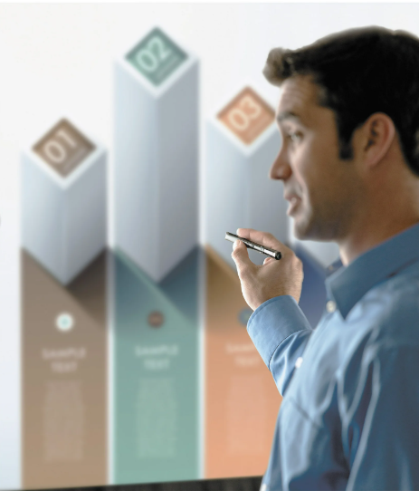 Man interacting with a digital display showing geometric shapes and numbers.