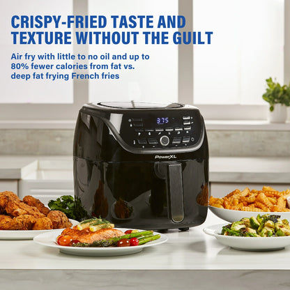 Black air fryer with plates of food on a kitchen counter, featuring text about health benefits.