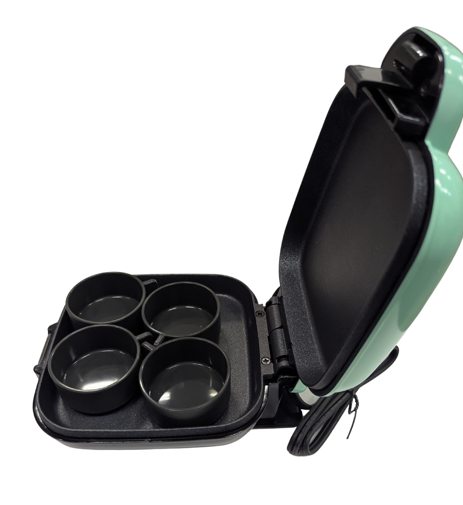 Mint green and black appliance with four round compartments on a white background