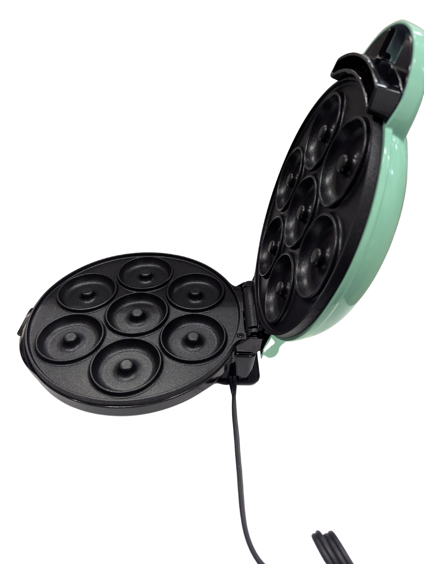 Mint green and black electric mini muffin maker on a white background