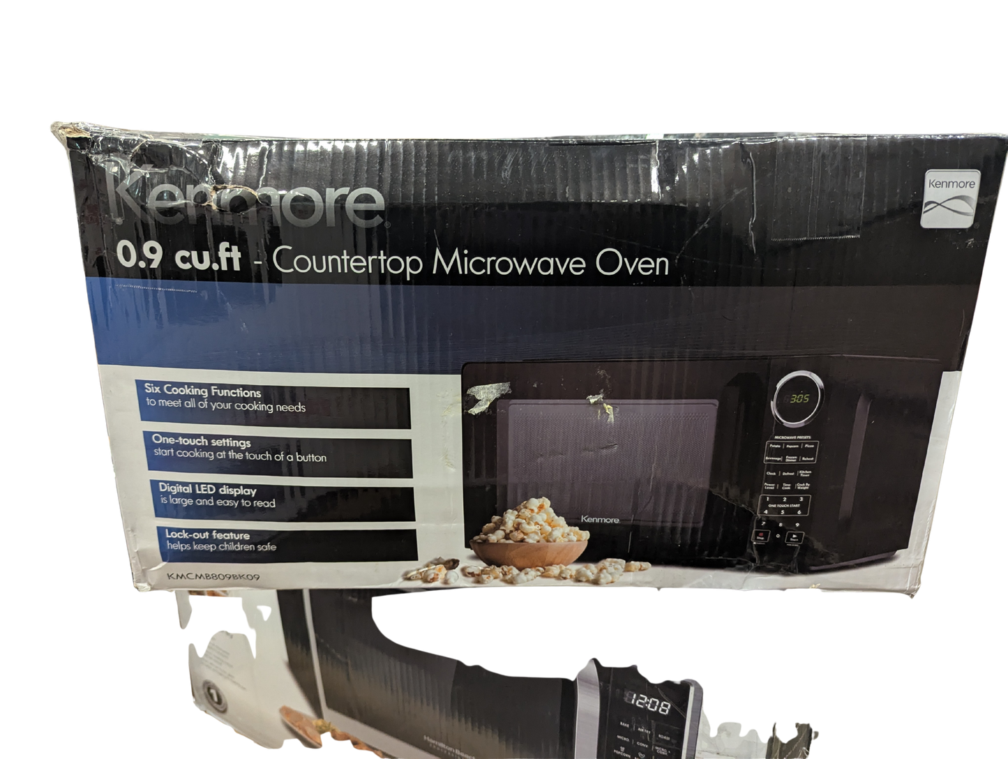 Kenmore microwave oven packaging on a white background