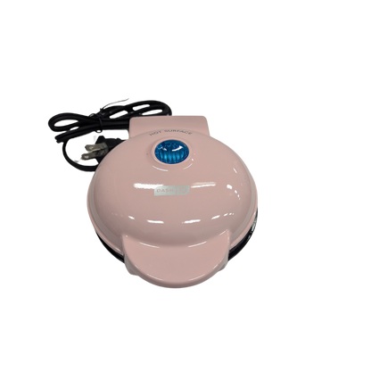 Pink waffle maker on a white background