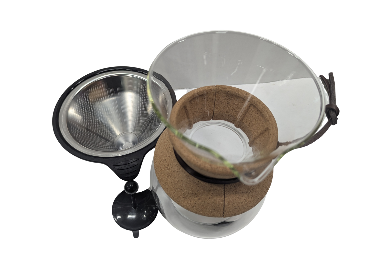 Coffee brewing apparatus with a metal funnel and glass container on a white background