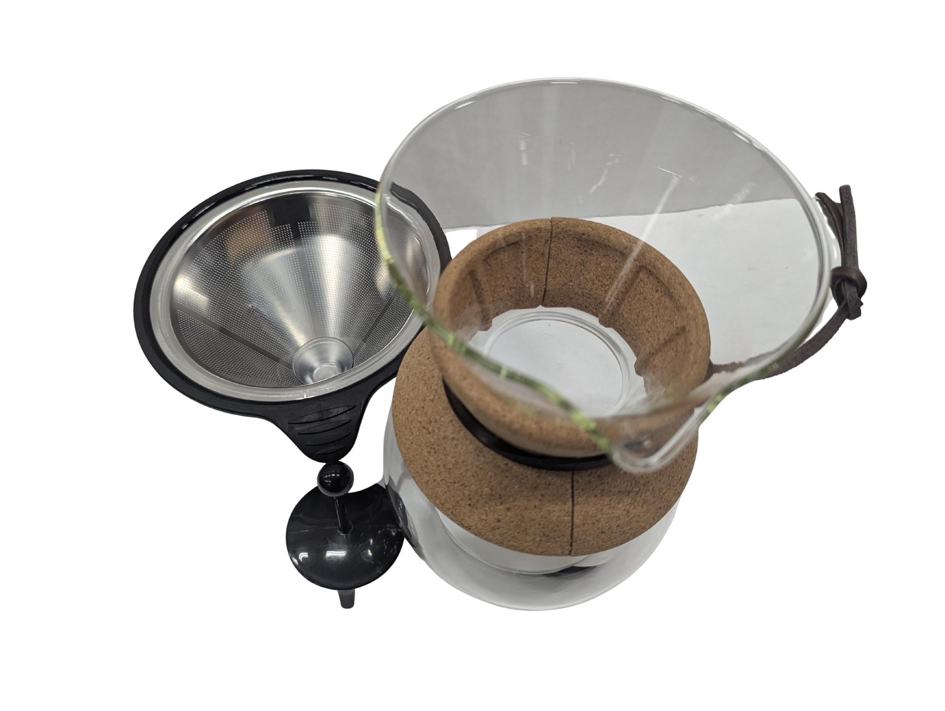 Coffee brewing apparatus with a metal funnel and glass container on a white background